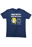 Tom Petty navy t-shirt featuring a drawing of his head and a checklist of "Things Tom Petty Doesn't Want You to Do" such as "Fade on Him" and "Live Like a Refugee", photographed on a white background.