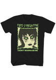 Front of Type O Negative Little Miss Scare - All black t-shirt featuring the text "Type O Negative I Don't Wanna Be Me" around an image of a girl with glowing green eyes and dark eye makeup, photographed on a white background.
