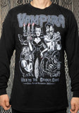 Front of Vampira 1982 Tour black long sleeve t-shirt featuring a black and white illustration of her with three ghouls and 'Vampira' in large grey text across the top with 'Meets the ghoul gang vinyl fetish records 1982' in grey text across the bottom, photographed on a model against a metal gate background.