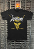 Venom Black Metal black t-shirt featuring the album artwork, photographed flat on a metal gate background.