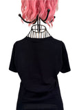 Black t-shirt back on a mannequin with pink hair against a white background