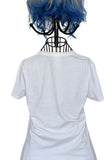 White t-shirt with a black mannequin head wearing blue hair on a white background