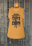 Mustard yellow sleeveless Bon Scott t-shirt featuring an image of him standing and 4 various headshot images on a metal gate background.