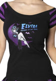 Elvira Mistress of the Dark black boatneck t-shirt with purple striped short sleeves featuring a graphic of Elvira reclining on a purple crescent moon with several bats flying around the text "Elvira Mistress of the Dark", photographed on a model on a white background.