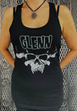 Black Glenn Danzig tank top featuring the text 'Glenn' in large white outlined letters and a white image of the horned skull artwork, on a metal gate background.