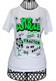 A white short-sleeve graphic t-shirt displayed on a black wire dress form mannequin. The shirt features a bold green and black graphic print with the text 'BUNGLE' and 'THERE'S A TRACTOR in my BALLS' with doodle drawings.
