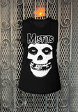 Misfits Crimson Ghost black sleeveless t-shirt featuring the classic imagery and logo, photographed flat on a metal gate background.