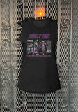 Motley Crue On With The Show black sleeveless t-shirt featuring the album artwork, name, and band name, photographed flat on a metal gate background.