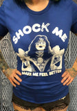Blue Ace Frehley Shock Me t-shirt featuring a white image of Ace with the words 'Shock Me' and 'Make Me Feel Better' in white text, on a metal gate background.