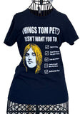 Tom Petty navy t-shirt featuring a drawing of his head and a checklist of "Things Tom Petty Doesn't Want You to Do" such as "Fade on Him" and "Live Like a Refugee", displayed on metal wire mannequin.