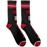 A pair of black socks featuring text "Iron Maiden" in red and white text on the foot,  two red and one white stripe in the middle at the top, with the text "Killers 81" below.