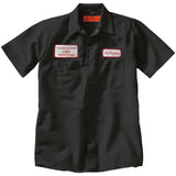 Close-up of black work shirt featuring a name patch that says 'M. Myers' on the left chest and patch with 'Haddonfield Memorial' on the right chest, displayed on a white background.