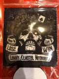 Lemmy Kilmister black coozie featuring a black and white stylized skull image of him with the words 'Born to Lose, Live to Win, Lemmy Kilmister Motorhead' in black text on white banner backgrounds, photographed inside the clear cellophane packaging.