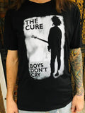 The Cure Boys Don't Cry black t-shirt featuring album artwork, on a model.