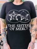 Sisters of Mercy black t-shirt featuring the classic gears logo and band name in white, photographed on a model.