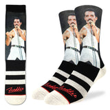 Men's crew socks featuring a graphic of Freddie Mercury wearing a white tank and pants performing on the upper leg and black and white horizontal stripes with red "Freddie" script near the toes, photographed on a white background.