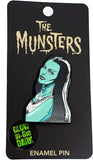 Close-up of the Munsters enamel glow-in-the-dark pin featuring Lily Munster's head and shoulders.