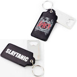Close-up of Slayer black fabric keychain with hidden bottle opener featuring the red and grey Slayer Evil Eagle band logo on the front and featuring the word 'SLAYTANIC' in bold white text on the back,  photographed on a white background.