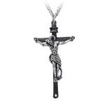 Gothic-style crucifix pendant necklace featuring a detailed silver horned figure on a blackened cross, suspended from a silver tone chain, photographed on a white background.