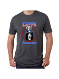 Frank Zappa for President grey t-shirt featuring an illustration of his head wearing a patriotic top hat circled in red and blue stars with the text 'Zappa for President' around the image, on a model against a white background.